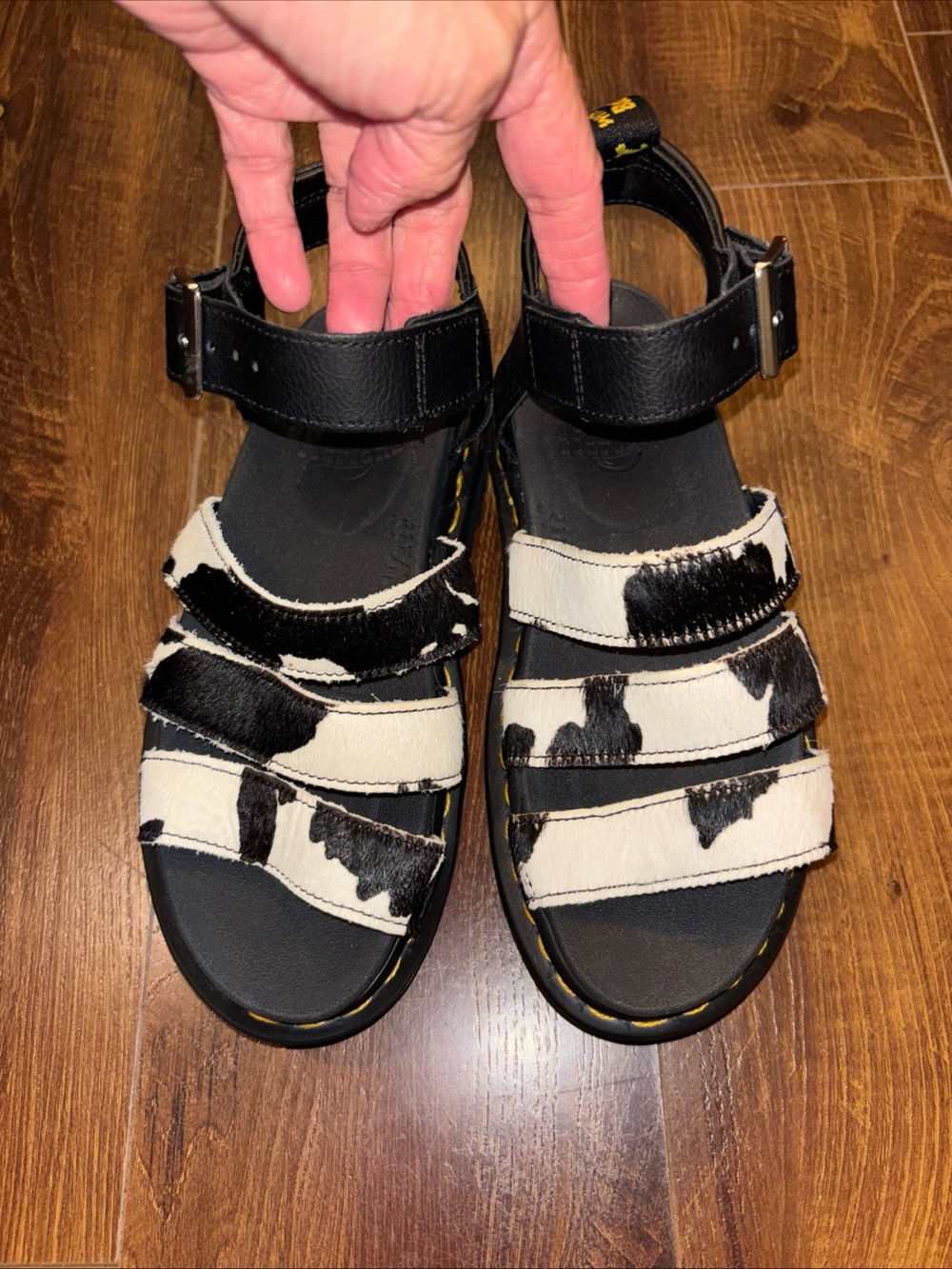 Dr. Martens Women’s Black and White Cow-Print Leather Strap Sandals